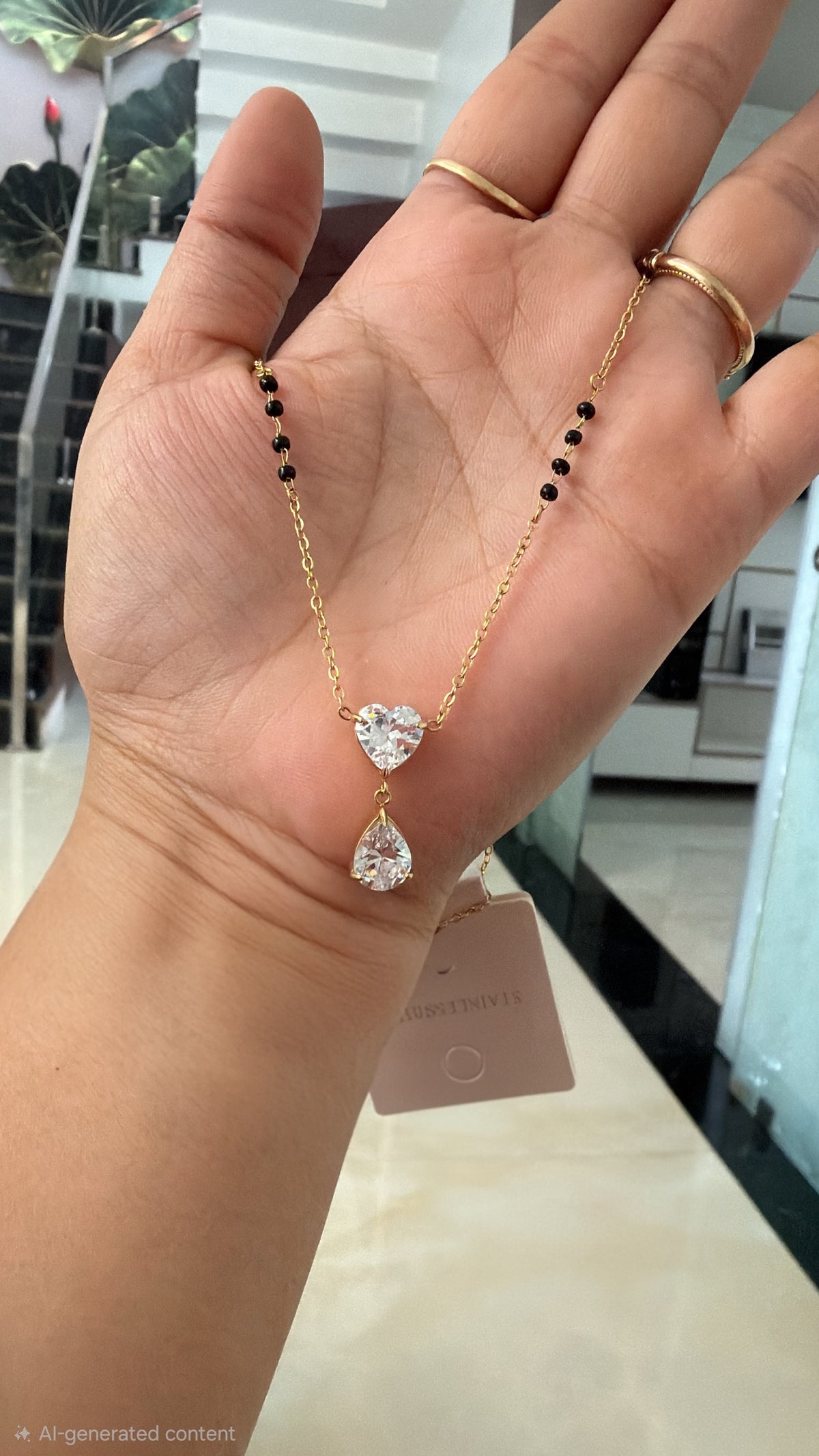 Black bead heart drop